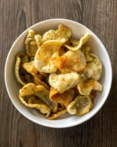 Crispy fish skin chips in rustic bowl