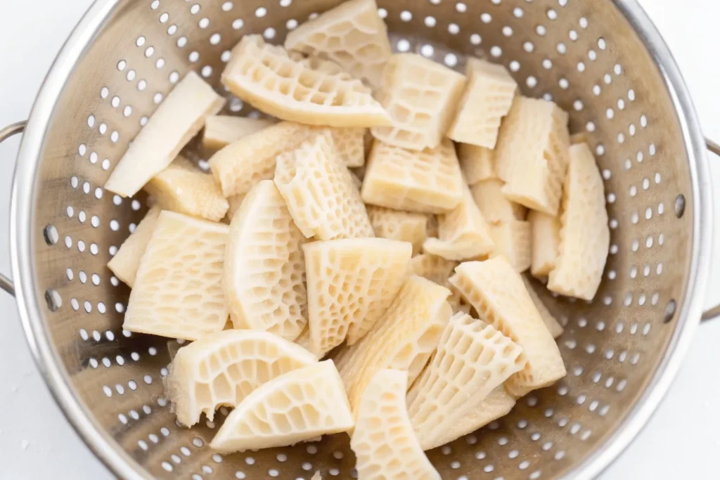 Beef Honeycomb Tripe: An Easy Recipe for Perfect Results 8 Demonstrating the crucial step of scraping beef honeycomb tripe to clean it thoroughly before cooking.